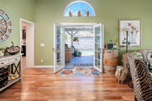26309 Emerald Dove Dr, Valencia, CA 91355 - entrance foyer with french doors, plenty of natural light, wood finished floors, and a towering ceiling