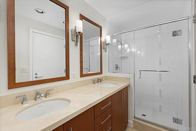 325 7th Ave Unit 609, San Diego, CA 92101 - bathroom with a shower stall and double vanity
