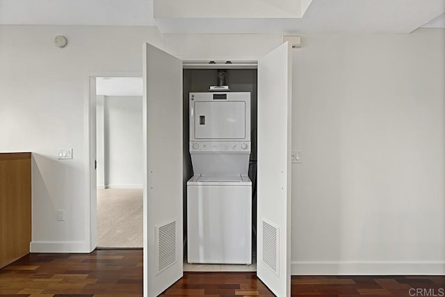 325 7th Ave Unit 609, San Diego, CA 92101 - washroom featuring stacked washer and clothes dryer and wood finished floors