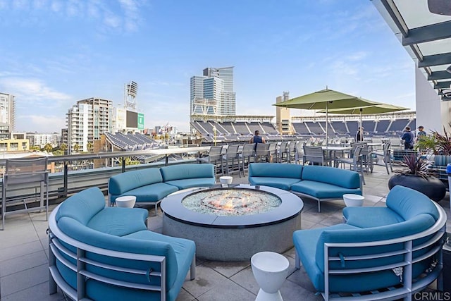325 7th Ave Unit 609, San Diego, CA 92101 - view of patio featuring an outdoor living space with a fire pit and a view of city