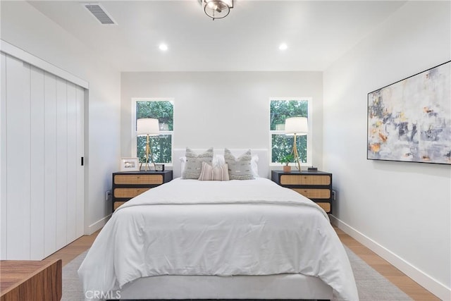 3924 Dublin Ave, Los Angeles, CA 90008 - bedroom with light wood finished floors, recessed lighting, and a closet