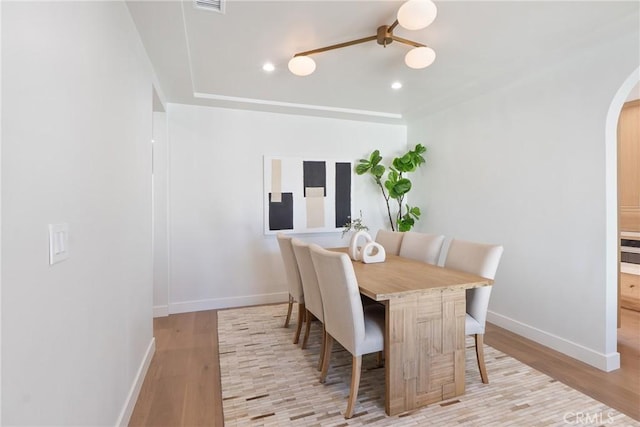 3924 Dublin Ave, Los Angeles, CA 90008 - dining space featuring arched walkways, light wood-style flooring, and recessed lighting