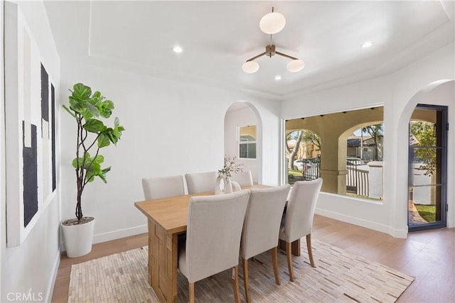 3924 Dublin Ave, Los Angeles, CA 90008 - dining space featuring arched walkways, light wood finished floors, and recessed lighting
