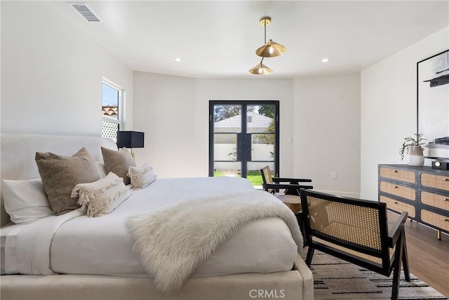 3924 Dublin Ave, Los Angeles, CA 90008 - bedroom with wood finished floors, multiple windows, and recessed lighting