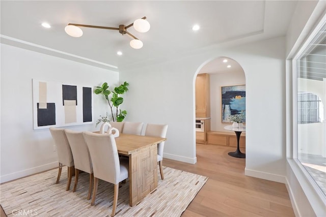 3924 Dublin Ave, Los Angeles, CA 90008 - dining area featuring light wood-type flooring, arched walkways, and recessed lighting