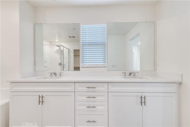 501 Pablo Rd Unit 48, Lake Elsinore, CA 92530 - full bathroom with double vanity, a shower stall, and a tub