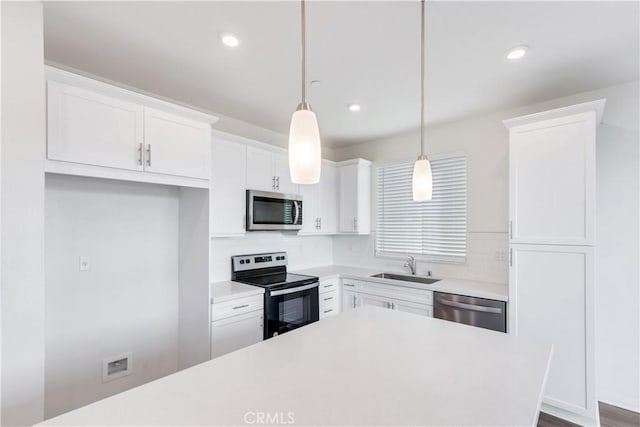 501 Pablo Rd Unit 48, Lake Elsinore, CA 92530 - kitchen with appliances with stainless steel finishes, white cabinets, light countertops, tasteful backsplash, and recessed lighting