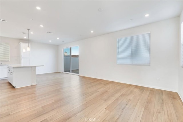 501 Pablo Rd Unit 48, Lake Elsinore, CA 92530 - unfurnished living room with light wood-type flooring and recessed lighting