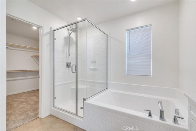 501 Pablo Rd Unit 48, Lake Elsinore, CA 92530 - full bath with a shower stall, a garden tub, a walk in closet, recessed lighting, and tile patterned floors