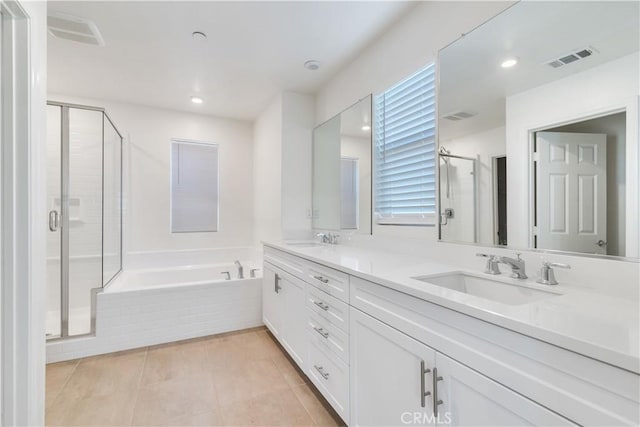 501 Pablo Rd Unit 48, Lake Elsinore, CA 92530 - bathroom featuring double vanity, a shower stall, a bath, tile patterned flooring, and recessed lighting