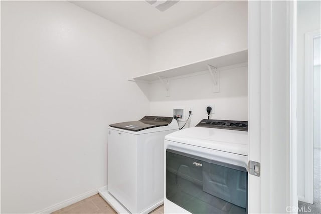 501 Pablo Rd Unit 48, Lake Elsinore, CA 92530 - laundry room with washer and clothes dryer and baseboards