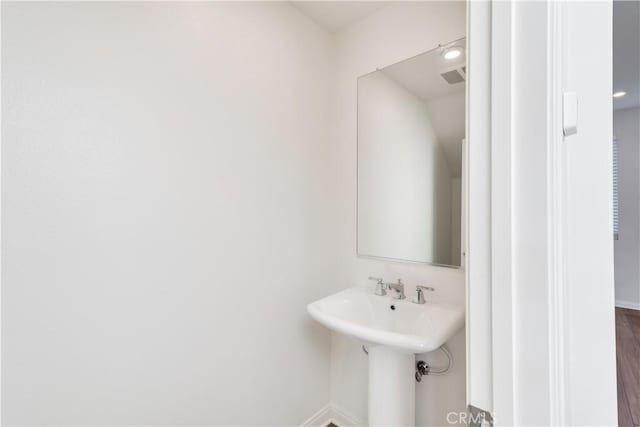 501 Pablo Rd Unit 48, Lake Elsinore, CA 92530 - bathroom featuring baseboards and a sink