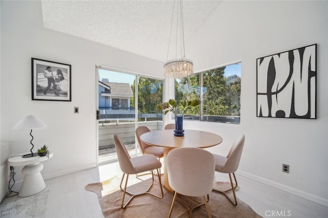 26970 Flo Ln Unit 310, Canyon Country, CA 91351 - dining area featuring a textured ceiling and a chandelier