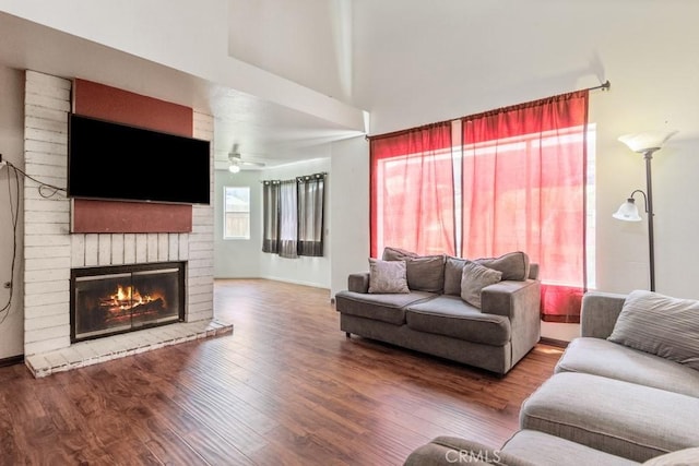 14625 Mountain High Dr, Fontana, CA 92337 - living room with a brick fireplace, wood finished floors, and ceiling fan