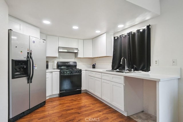 14625 Mountain High Dr, Fontana, CA 92337 - kitchen with stainless steel fridge with ice dispenser, black range with gas cooktop, under cabinet range hood, white cabinets, and recessed lighting