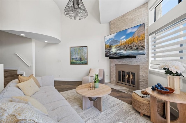 1114 Melrose Ave Unit 3, Glendale, CA 91202 - living area with a high ceiling, wood finished floors, a large fireplace, and stairway