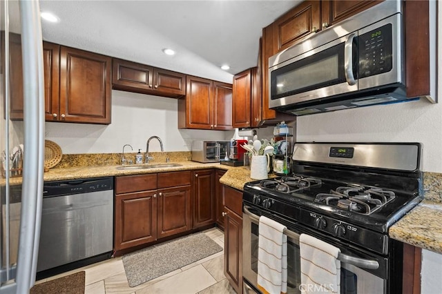 1114 Melrose Ave Unit 3, Glendale, CA 91202 - kitchen with stainless steel appliances, light stone countertops, recessed lighting, and light tile patterned floors