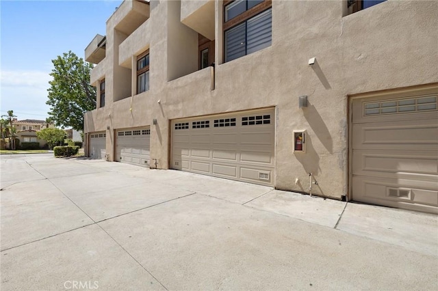1114 Melrose Ave Unit 3, Glendale, CA 91202 - view of building exterior featuring an attached garage and driveway