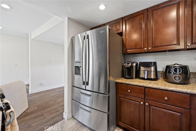1114 Melrose Ave Unit 3, Glendale, CA 91202 - kitchen with stainless steel fridge with ice dispenser, light wood-type flooring, recessed lighting, range, and light stone countertops