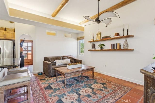 3606 W Chandler Blvd, Burbank, CA 91505 - living room featuring arched walkways, tile patterned floors, and beam ceiling