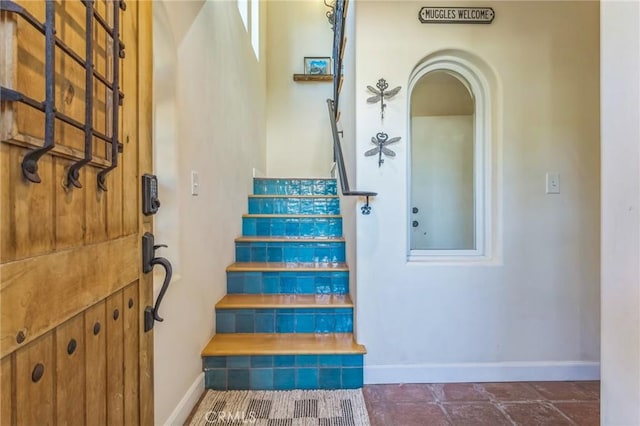 3606 W Chandler Blvd, Burbank, CA 91505 - staircase featuring baseboards and arched walkways