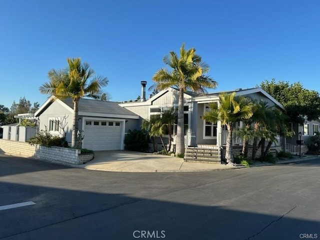 2851 Rolling Hills Dr Unit 45, Fullerton, CA 92835 - view of front facade with concrete driveway and an attached garage