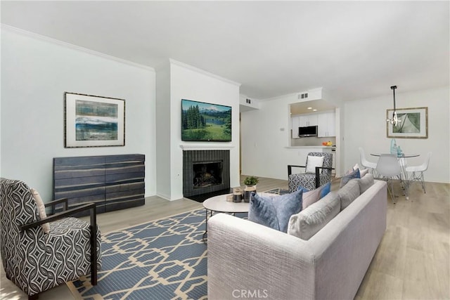 10861 Moorpark St Unit 203, North Hollywood, CA 91602 - living area featuring light wood-style flooring and a fireplace