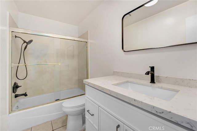 10861 Moorpark St Unit 203, North Hollywood, CA 91602 - full bathroom featuring vanity, bath / shower combo with glass door, and tile patterned floors