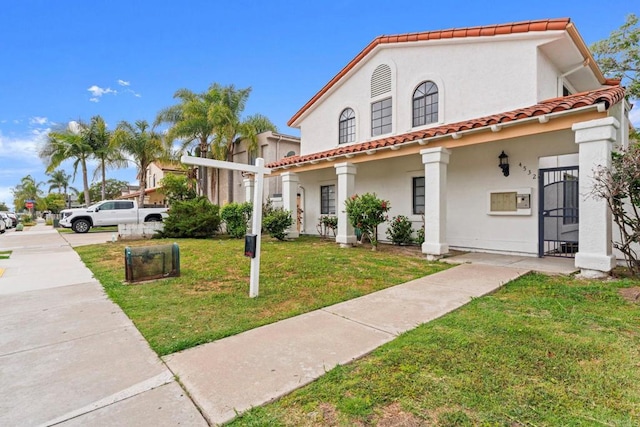 4532 Dawson Ave, San Diego, CA 92115 - mediterranean / spanish home with a tiled roof, stucco siding, and a front lawn