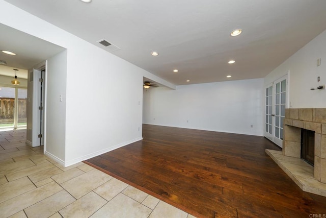 1651 S Juniper St Unit 172, Escondido, CA 92025 - unfurnished living room with a fireplace, recessed lighting, ceiling fan, and wood finished floors