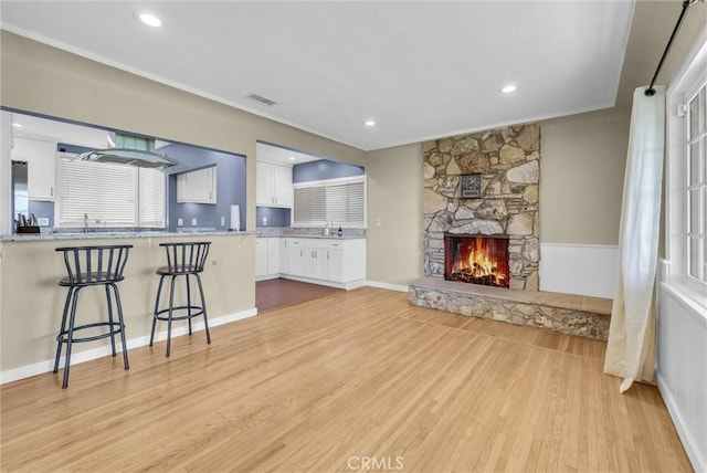 918 Dorothea Rd, La Habra Heights, CA 90631 - living room with a fireplace, light wood finished floors, and recessed lighting
