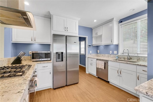 918 Dorothea Rd, La Habra Heights, CA 90631 - kitchen with appliances with stainless steel finishes, exhaust hood, light wood-style floors, white cabinetry, and recessed lighting