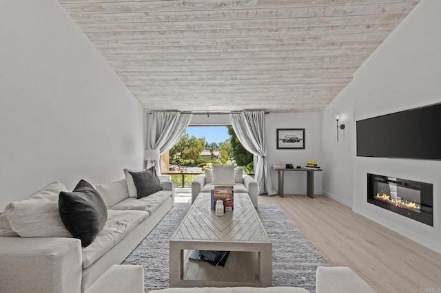 20 Lake Helix Dr, La Mesa, CA 91941 - living area featuring a glass covered fireplace, vaulted ceiling, wood ceiling, and wood finished floors
