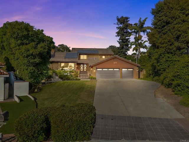 20 Lake Helix Dr, La Mesa, CA 91941 - view of front of house with a front lawn, solar panels, concrete driveway, an attached garage, and stucco siding