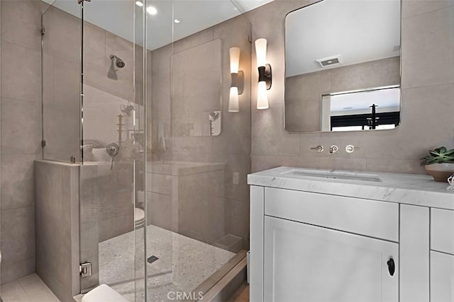 21611 Ocean Vista Dr, Laguna Beach, CA 92651 - full bathroom with tile walls, vanity, and a shower stall