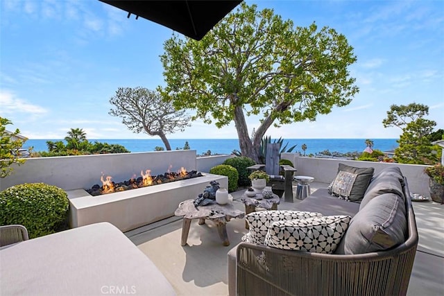 21611 Ocean Vista Dr, Laguna Beach, CA 92651 - view of patio featuring a water view and an outdoor living space with a fire pit