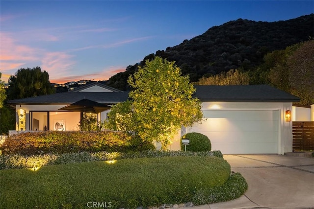 21611 Ocean Vista Dr, Laguna Beach, CA 92651 - view of front of home featuring driveway, a garage, and a mountain view