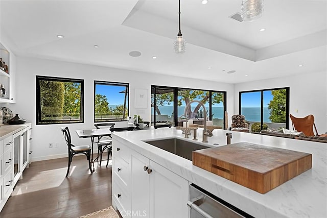 21611 Ocean Vista Dr, Laguna Beach, CA 92651 - kitchen with healthy amount of natural light, recessed lighting, wood finished floors, white cabinetry, and pendant lighting