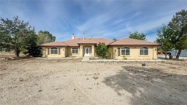 11126 Arena Rd, Pinon Hills, CA 92372 - view of front of property featuring stucco siding, a chimney, and a tile roof