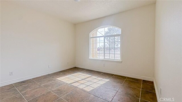 11126 Arena Rd, Pinon Hills, CA 92372 - tiled spare room with baseboards