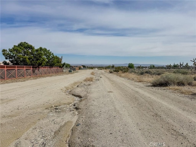 11126 Arena Rd, Pinon Hills, CA 92372 - view of dirt / gravel road featuring a view of countryside