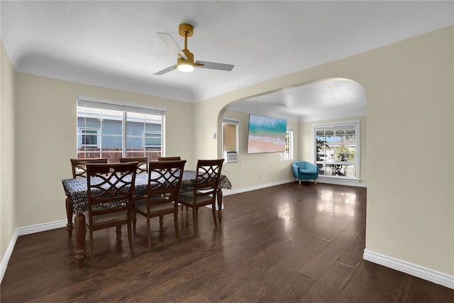 6059 Riverside Ave, Huntington Park, CA 90255 - dining space with arched walkways, dark wood finished floors, plenty of natural light, and ceiling fan