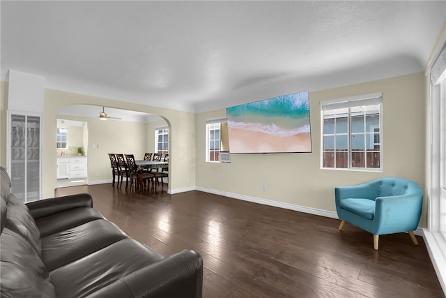6059 Riverside Ave, Huntington Park, CA 90255 - living area featuring arched walkways, hardwood / wood-style floors, ceiling fan, and plenty of natural light