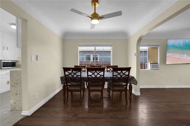 6059 Riverside Ave, Huntington Park, CA 90255 - dining area featuring arched walkways, ceiling fan, wood finished floors, and cooling unit