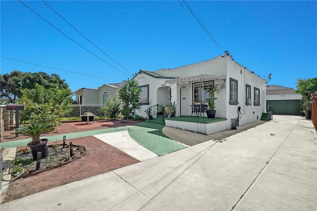 6059 Riverside Ave, Huntington Park, CA 90255 - mediterranean / spanish house featuring stucco siding and a patio area