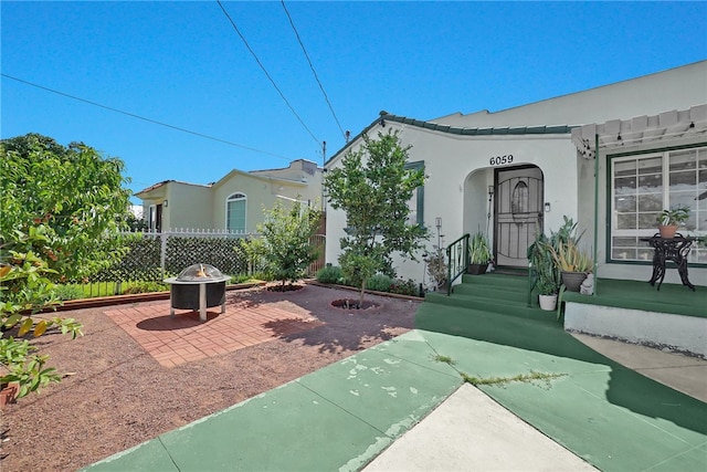 6059 Riverside Ave, Huntington Park, CA 90255 - view of patio featuring an outdoor fire pit