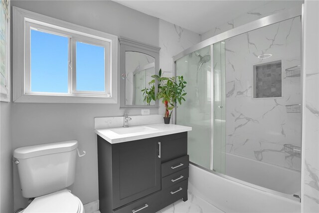 6059 Riverside Ave, Huntington Park, CA 90255 - full bathroom with vanity, marble look tile flooring, and combined bath / shower with glass door