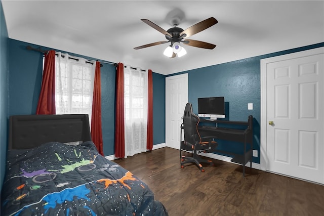 6059 Riverside Ave, Huntington Park, CA 90255 - bedroom featuring wood finished floors, a textured wall, a desk, ceiling fan, and a closet