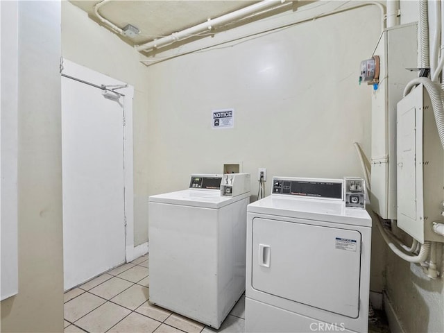 117 N Toluca St, Los Angeles, CA 90026 - community laundry with separate washer and dryer and light tile patterned flooring