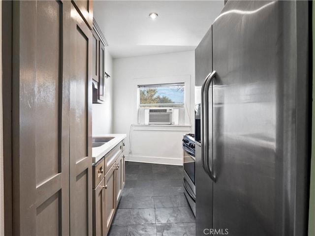 117 N Toluca St, Los Angeles, CA 90026 - kitchen featuring appliances with stainless steel finishes, cooling unit, and light countertops